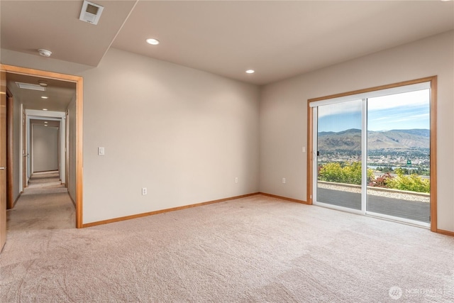 582 Lower Daniels Dr, East Wenatchee, WA 98802 - spare room with light carpet, a mountain view, a smoke detector, and recessed lighting