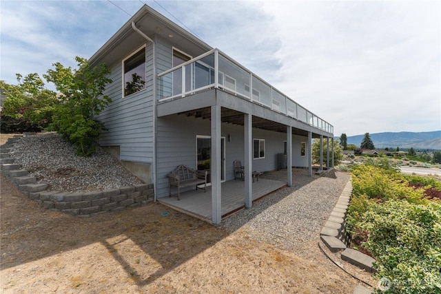 582 Lower Daniels Dr, East Wenatchee, WA 98802 - back of house with a deck with mountain view