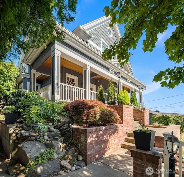 1012 2nd Ave W, Seattle, WA 98119 - view of front facade featuring a porch and stairs