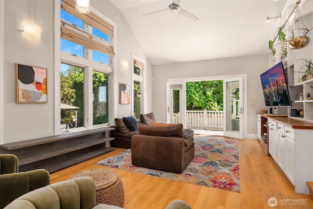 1012 2nd Ave W, Seattle, WA 98119 - living area with light wood-type flooring, ceiling fan, and high vaulted ceiling