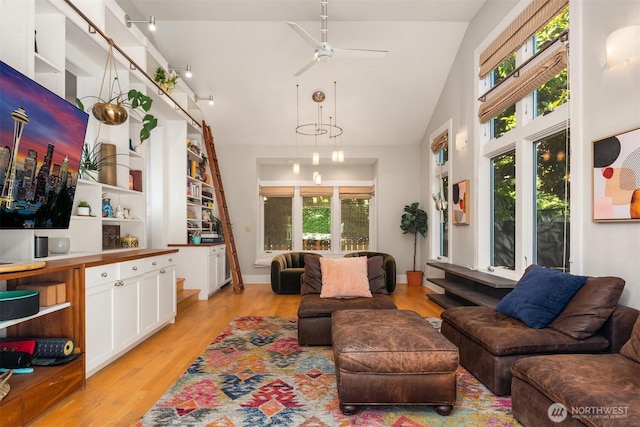 1012 2nd Ave W, Seattle, WA 98119 - living room featuring light wood-type flooring, high vaulted ceiling, and ceiling fan