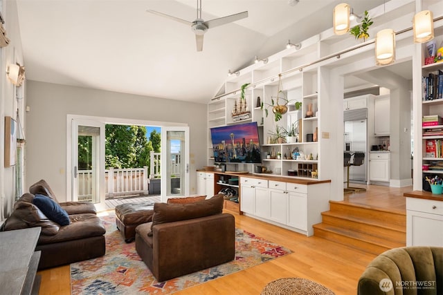 1012 2nd Ave W, Seattle, WA 98119 - living room with light wood-style flooring, ceiling fan, and high vaulted ceiling