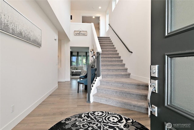 3359 Terry Ln, Enumclaw, WA 98022 - entrance foyer featuring stairs, wood finished floors, and a high ceiling