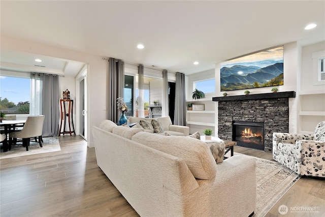 3359 Terry Ln, Enumclaw, WA 98022 - living area featuring light wood-type flooring, plenty of natural light, a fireplace, and recessed lighting