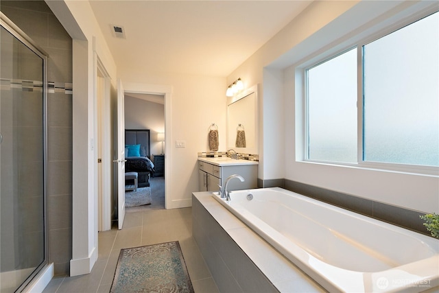 3359 Terry Ln, Enumclaw, WA 98022 - ensuite bathroom featuring vanity, a garden tub, a stall shower, and tile patterned flooring