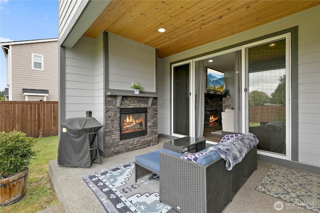 3359 Terry Ln, Enumclaw, WA 98022 - view of patio featuring an outdoor stone fireplace and grilling area