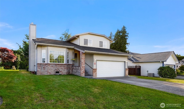 7969 W Golf Course Dr, Birch Bay, WA 98230 - view of front of house with asphalt driveway, a chimney, brick siding, and a garage