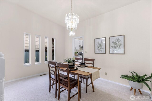 7969 W Golf Course Dr, Birch Bay, WA 98230 - dining room with light carpet and a chandelier