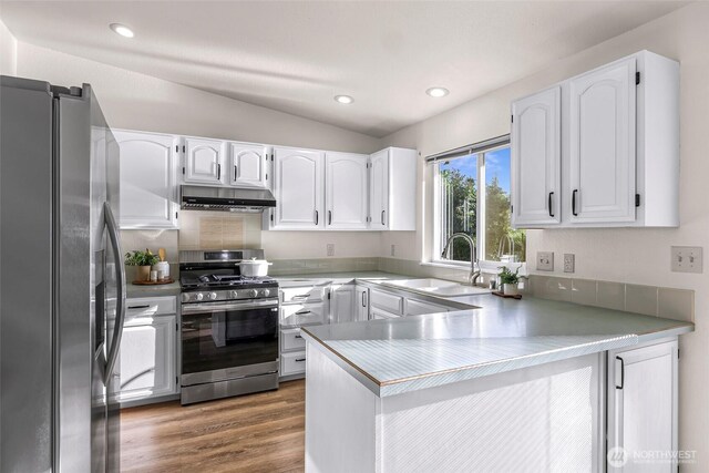 7969 W Golf Course Dr, Birch Bay, WA 98230 - kitchen featuring appliances with stainless steel finishes, a peninsula, under cabinet range hood, white cabinetry, and recessed lighting