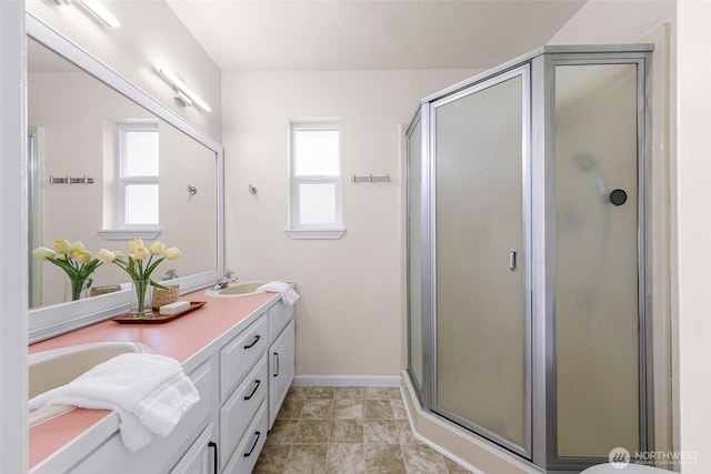 7969 W Golf Course Dr, Birch Bay, WA 98230 - bathroom with double vanity, healthy amount of natural light, and a stall shower