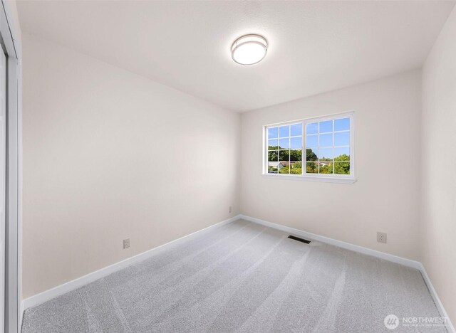 7969 W Golf Course Dr, Birch Bay, WA 98230 - spare room with light carpet and baseboards