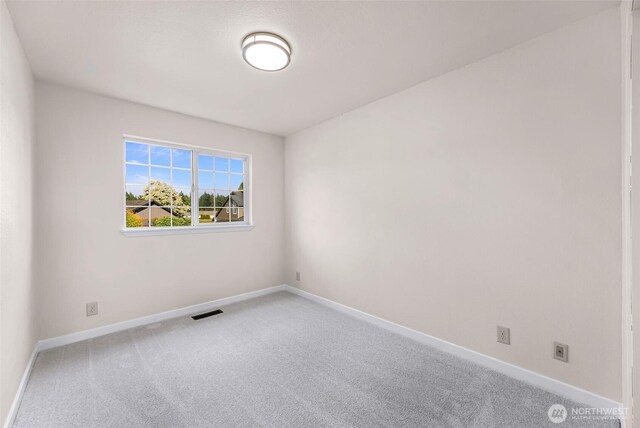 7969 W Golf Course Dr, Birch Bay, WA 98230 - spare room featuring carpet floors and baseboards