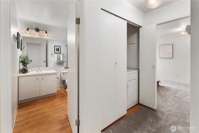 5300 Harbour Pointe Blvd Unit 302G, Mukilteo, WA 98275 - washroom featuring washer / dryer and light wood-style floors