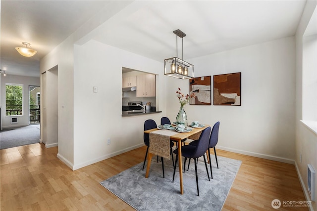 5300 Harbour Pointe Blvd Unit 302G, Mukilteo, WA 98275 - dining space featuring light wood-style flooring and a chandelier