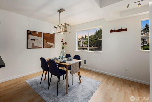 5300 Harbour Pointe Blvd Unit 302G, Mukilteo, WA 98275 - dining area with wood finished floors and a chandelier