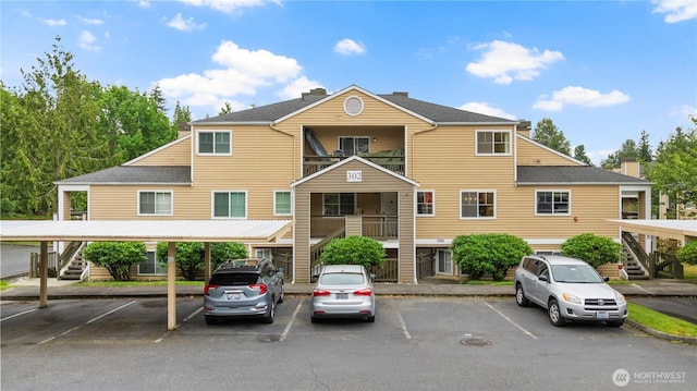 5300 Harbour Pointe Blvd Unit 302G, Mukilteo, WA 98275 - view of property with stairs and covered and uncovered parking