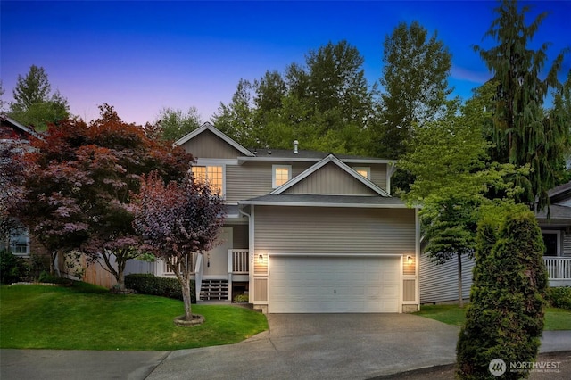 14926 Woodland Ave E, Puyallup, WA 98375 - view of front of property with a front yard, concrete driveway, and a garage