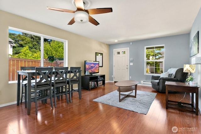 1736 E 39th St, Tacoma, WA 98404 - living room with baseboard heating, ceiling fan, and wood finished floors