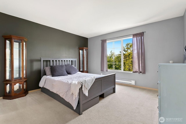 1736 E 39th St, Tacoma, WA 98404 - bedroom with light carpet and a baseboard heating unit