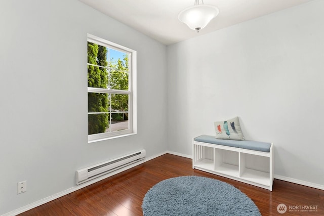 1736 E 39th St, Tacoma, WA 98404 - spare room featuring a baseboard heating unit and wood finished floors