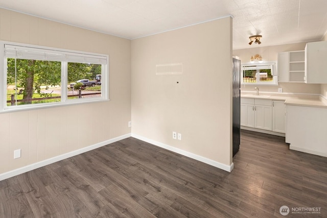 14226 44th St NE, Lake Stevens, WA 98258 - empty room with healthy amount of natural light and dark wood finished floors