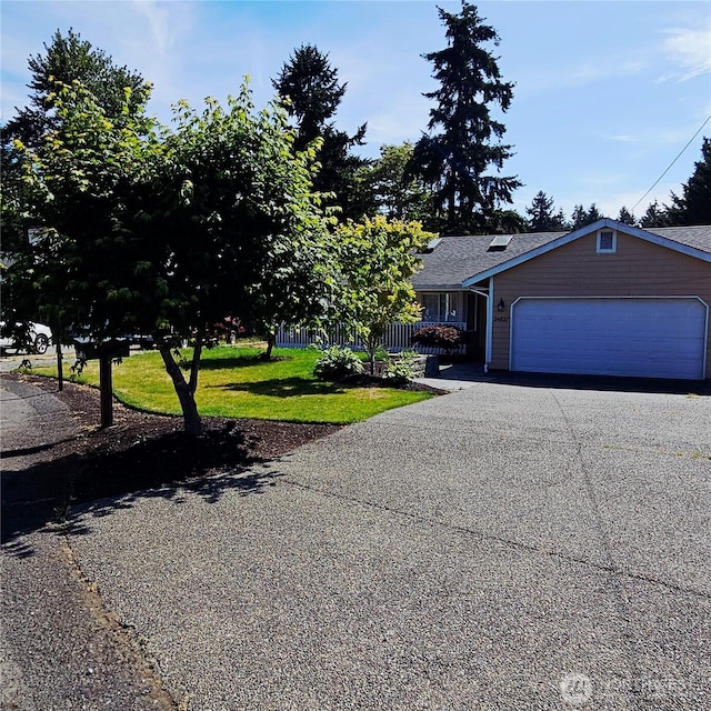24827 36th Ave E, Spanaway, WA 98387 - view of front of home with driveway, a front lawn, and an attached garage