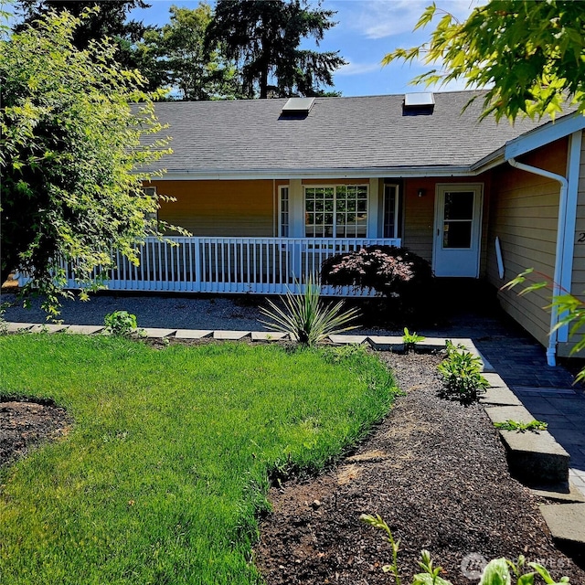 24827 36th Ave E, Spanaway, WA 98387 - single story home featuring covered porch, roof with shingles, and a front lawn