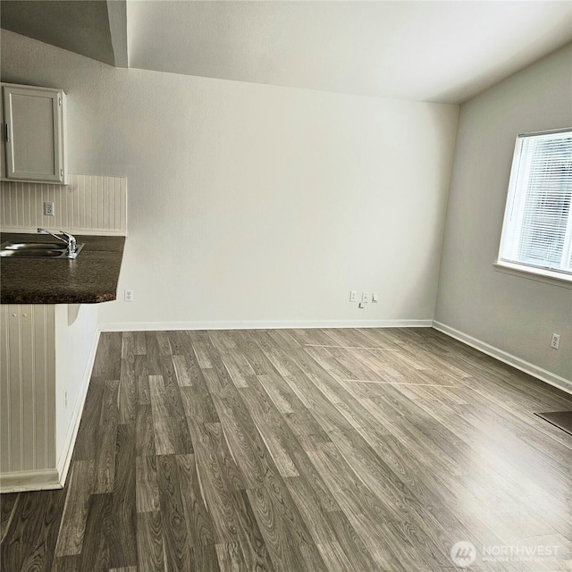 24827 36th Ave E, Spanaway, WA 98387 - unfurnished dining area with dark wood finished floors and vaulted ceiling