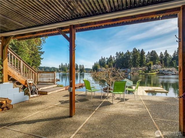 7217 20th Ave SE, Lacey, WA 98503 - view of patio featuring a water view, view of scattered trees, and a dock