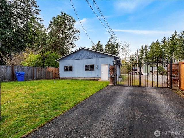 7217 20th Ave SE, Lacey, WA 98503 - view of front facade featuring a gate and driveway