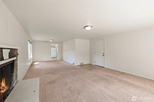 2004 N 143rd St, Seattle, WA 98133 - unfurnished living room featuring a stone fireplace and light colored carpet