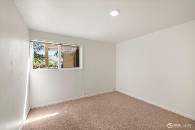 2004 N 143rd St, Seattle, WA 98133 - carpeted empty room featuring baseboards