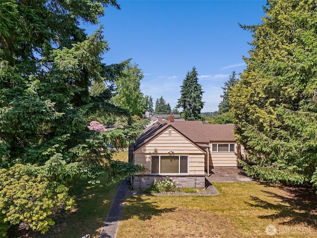 2004 N 143rd St, Seattle, WA 98133 - view of front facade featuring a front lawn and brick siding