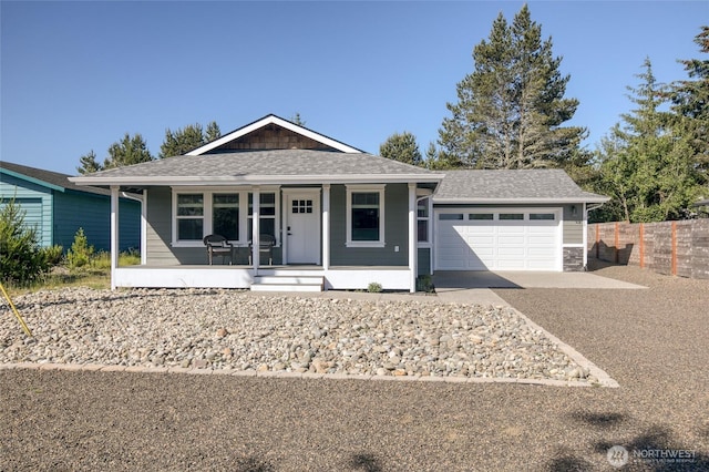 213 N Wynoochee Dr SW, Ocean Shores, WA 98569 - ranch-style house featuring a porch, concrete driveway, an attached garage, and a shingled roof