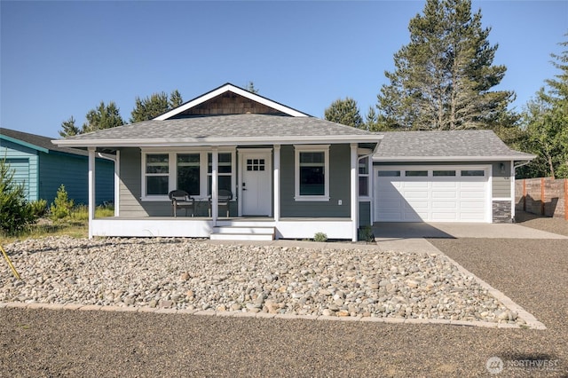 213 N Wynoochee Dr SW, Ocean Shores, WA 98569 - single story home with a porch, driveway, a garage, and roof with shingles