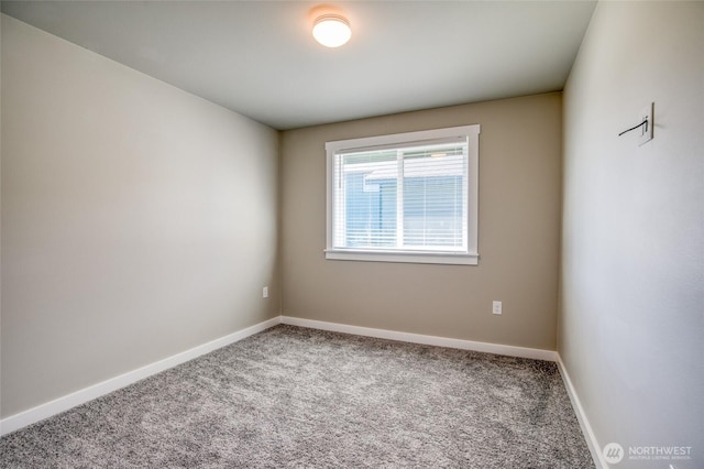 213 N Wynoochee Dr SW, Ocean Shores, WA 98569 - carpeted empty room with baseboards