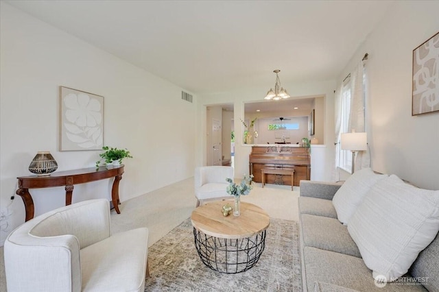 15204 48th Ave SE, Everett, WA 98208 - carpeted living room featuring a chandelier