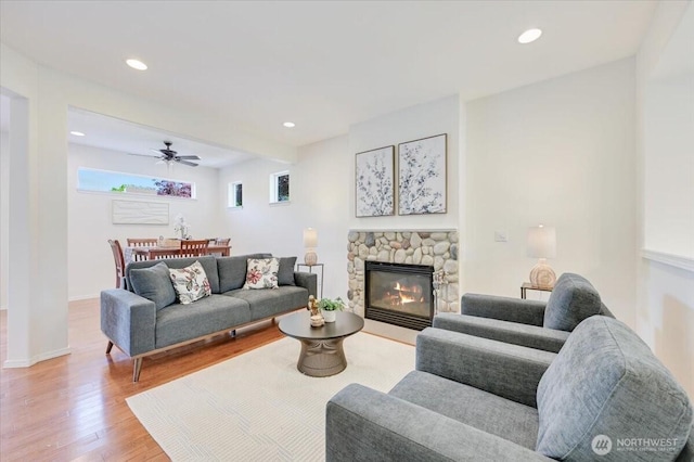 15204 48th Ave SE, Everett, WA 98208 - living area featuring light wood-style flooring, a fireplace, recessed lighting, and ceiling fan