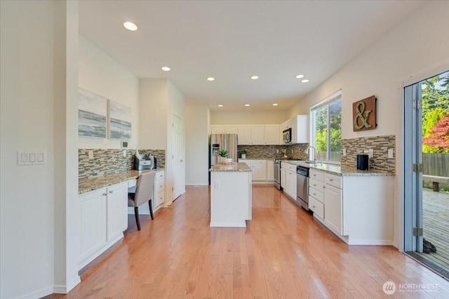 15204 48th Ave SE, Everett, WA 98208 - kitchen with appliances with stainless steel finishes, backsplash, white cabinets, light wood-type flooring, and recessed lighting