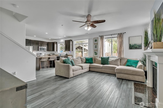 17712 17th Ave E, Spanaway, WA 98387 - living area featuring ceiling fan, light wood-type flooring, recessed lighting, and a fireplace