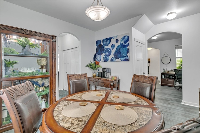 17712 17th Ave E, Spanaway, WA 98387 - dining room featuring arched walkways and wood finished floors
