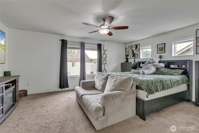 17712 17th Ave E, Spanaway, WA 98387 - carpeted bedroom with multiple windows and a ceiling fan