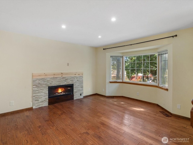 10122 50th Pl W, Mukilteo, WA 98275 - unfurnished living room with wood finished floors, a fireplace, and recessed lighting