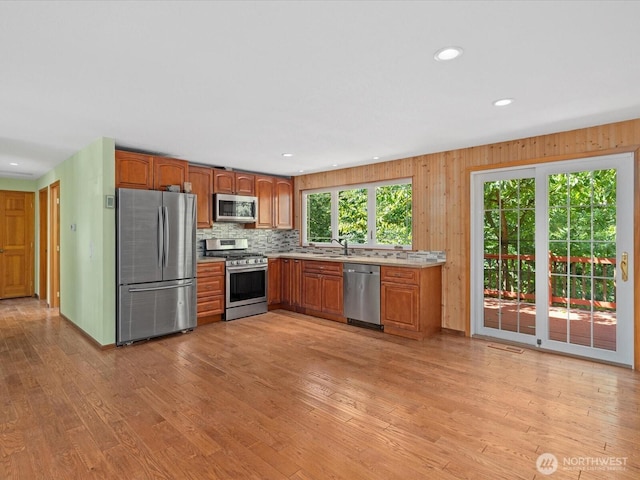 10122 50th Pl W, Mukilteo, WA 98275 - kitchen with appliances with stainless steel finishes, light wood-style flooring, light countertops, tasteful backsplash, and recessed lighting