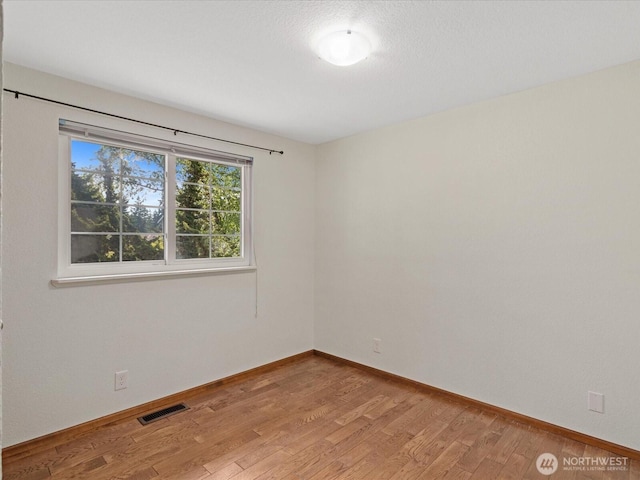 10122 50th Pl W, Mukilteo, WA 98275 - empty room with light wood finished floors and baseboards