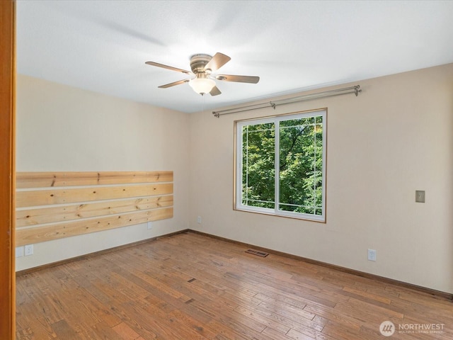 10122 50th Pl W, Mukilteo, WA 98275 - unfurnished room featuring a ceiling fan and wood-type flooring