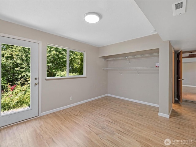 10122 50th Pl W, Mukilteo, WA 98275 - unfurnished bedroom with light wood-style floors and baseboards