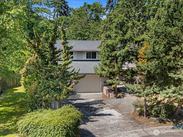 10122 50th Pl W, Mukilteo, WA 98275 - view of front of house featuring driveway, a shingled roof, and a front yard
