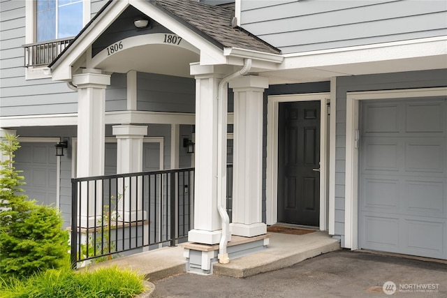 16125 Juanita Woodinville Way NE Unit 1807, Bothell, WA 98011 - view of exterior entry featuring a garage and a porch