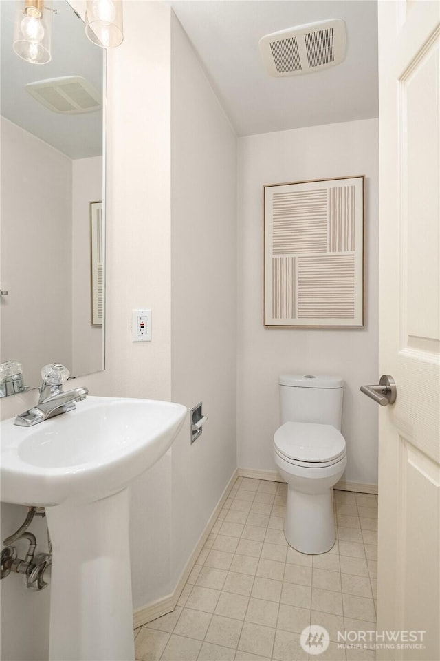 16125 Juanita Woodinville Way NE Unit 1807, Bothell, WA 98011 - half bathroom with toilet and tile patterned floors